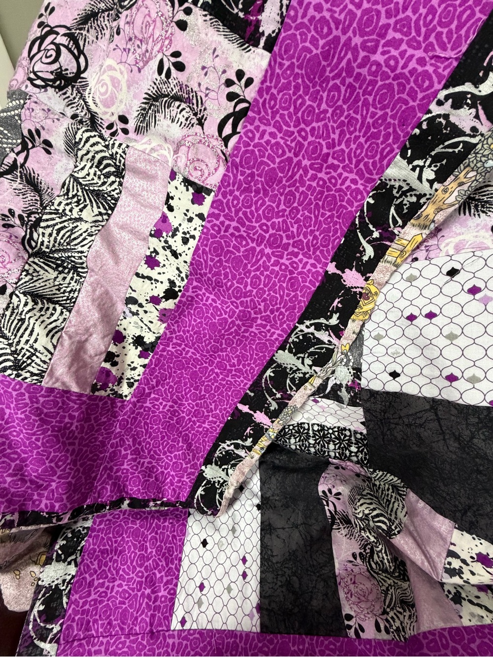 Vibrant Purple Patchwork Quilt Accent